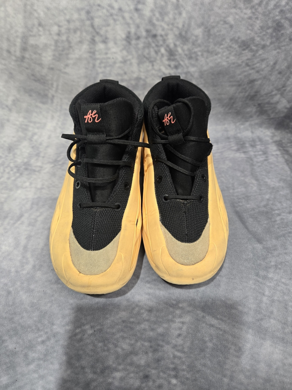 Adidas AE 1 'With Love' sneakers, featuring a peach-orange perforated TPU